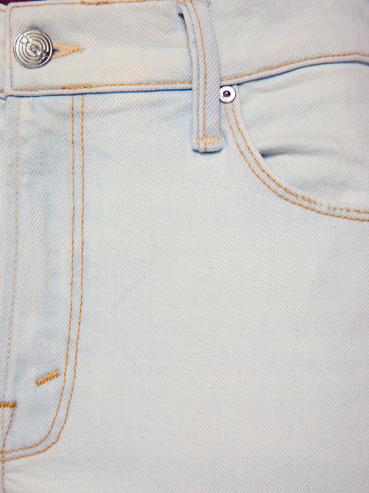 Swatch view of a woman in a bleached  light blue mid-rise straight leg has a zip fly and hits at the ankle with a clean hem. 