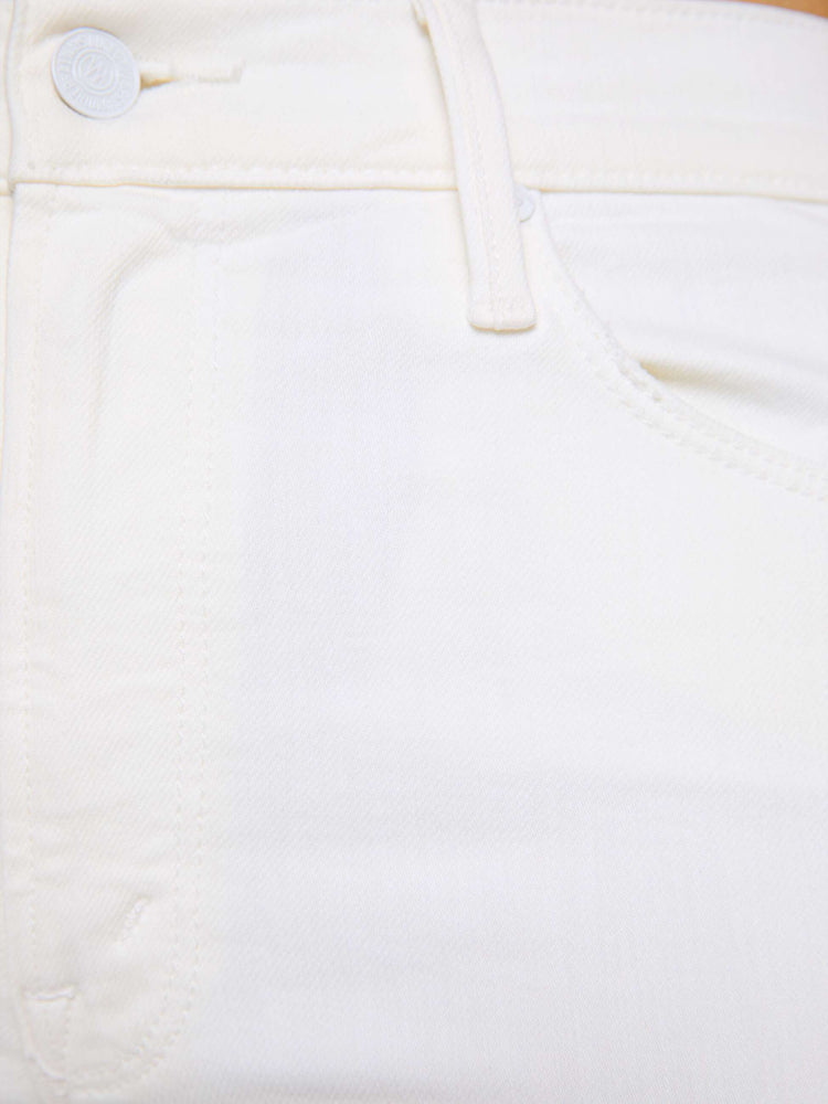 Close up swatch view of white denim jeans.