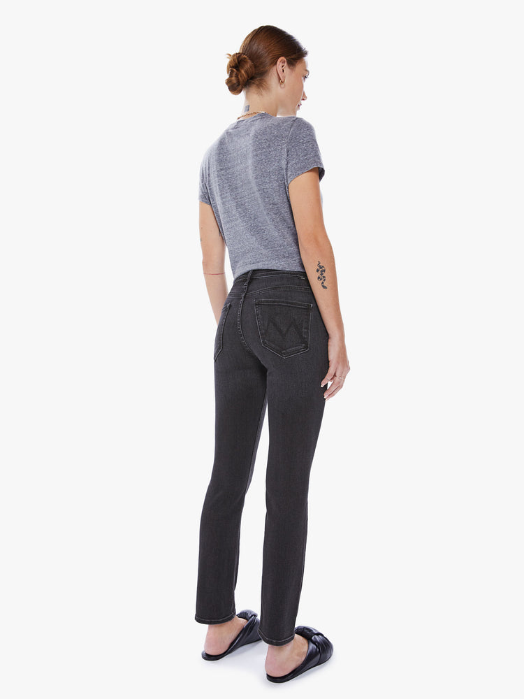 Back view of women's black straight leg jean with mid-rise and ankle length inseam.