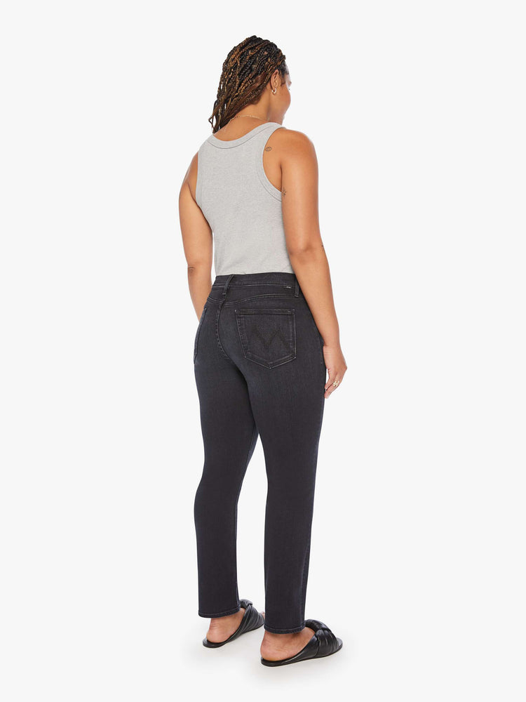 Back view of women's black straight leg jean with mid-rise and ankle length inseam.