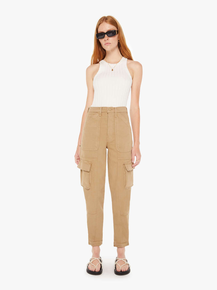 Front view of a womens brown cargo pants featuring a high rise and flood length hem.