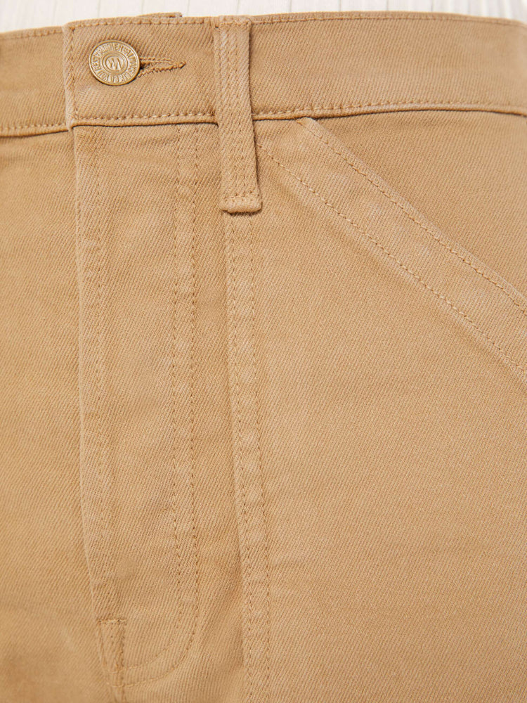 Close up detail view of a brown cotton pant.