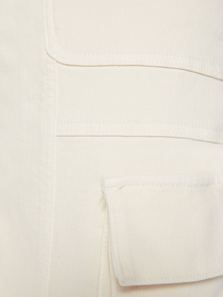 Swatch view of a woman super high waisted cargo pant with a barrel leg, patch pockets and a long inseam with snaps at the hem in an off-white color.