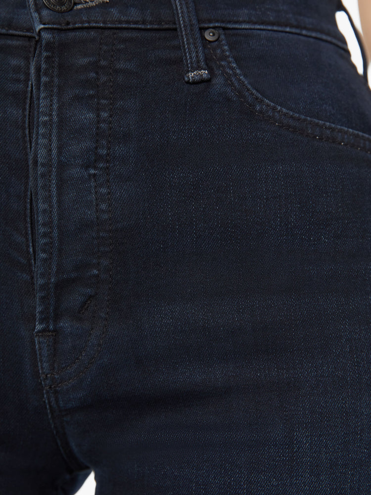 Swatch view of a woman high-waisted wide leg has a button fly, 31-inch inseam and clean hem in dark blue wash.