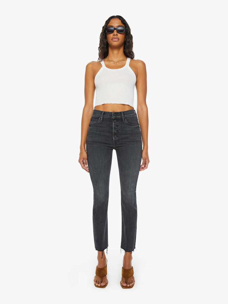 Front view of women's straight leg jean with exposed button fly in a faded black wash.