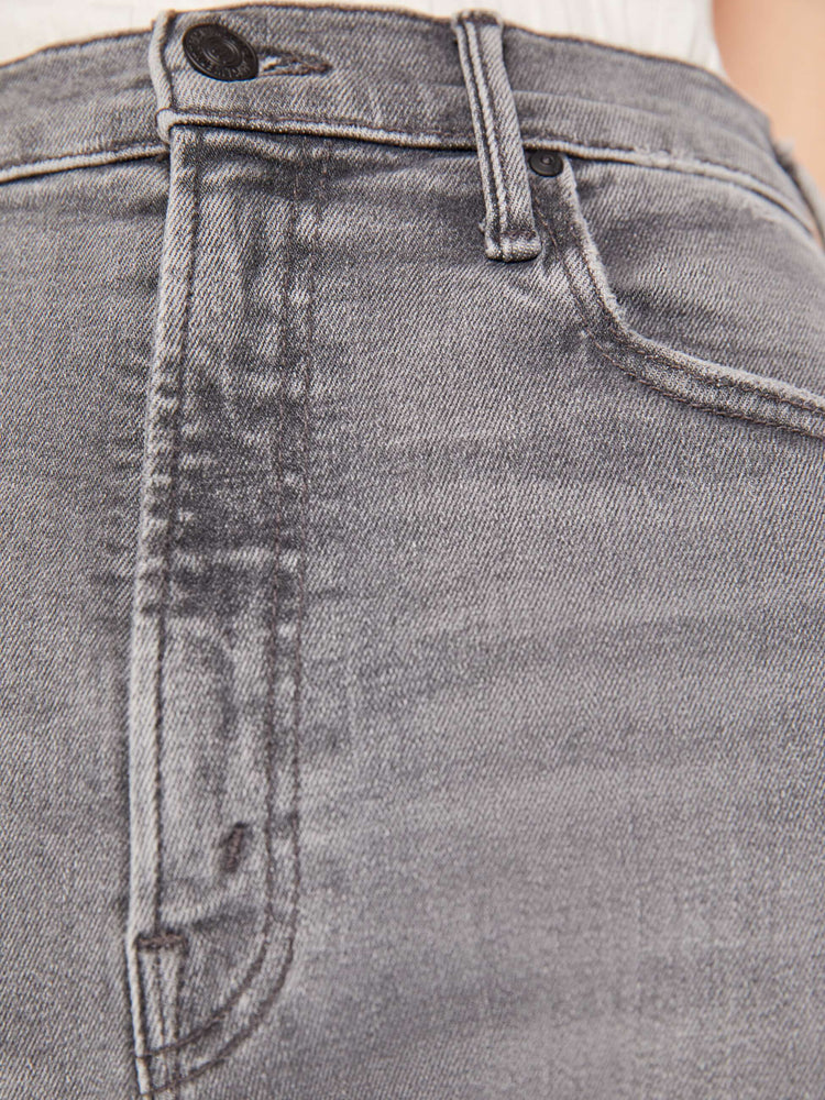 Close up swatch detail view of a grey wash jean.