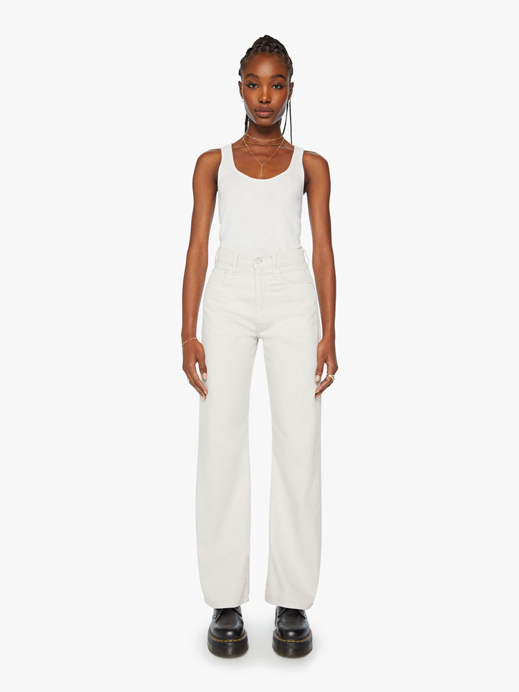 Front view of a woman super wide-leg pants with a high rise and a long 34-inch inseam with a clean hem in an off white hue.