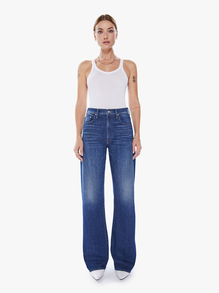Front view of a woman super wide-leg jeans with a high rise and a long 34-inch inseam in a blue hue.