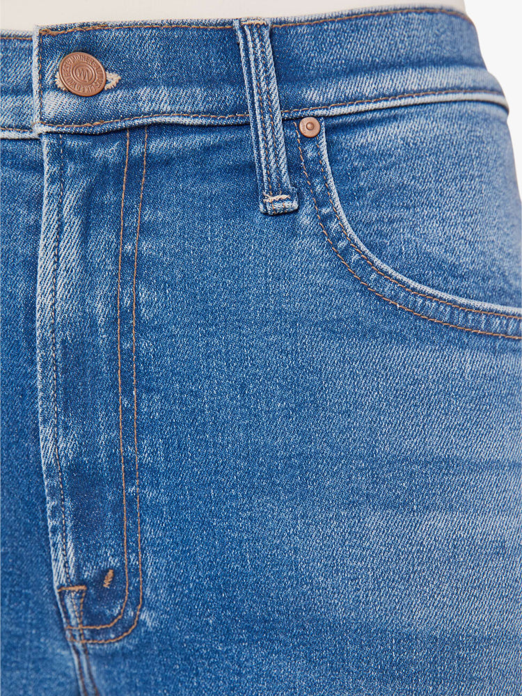 Swatch view of a woman igh-waisted jeans with a loose wide leg and an ankle-length inseam in a medium blue wash.