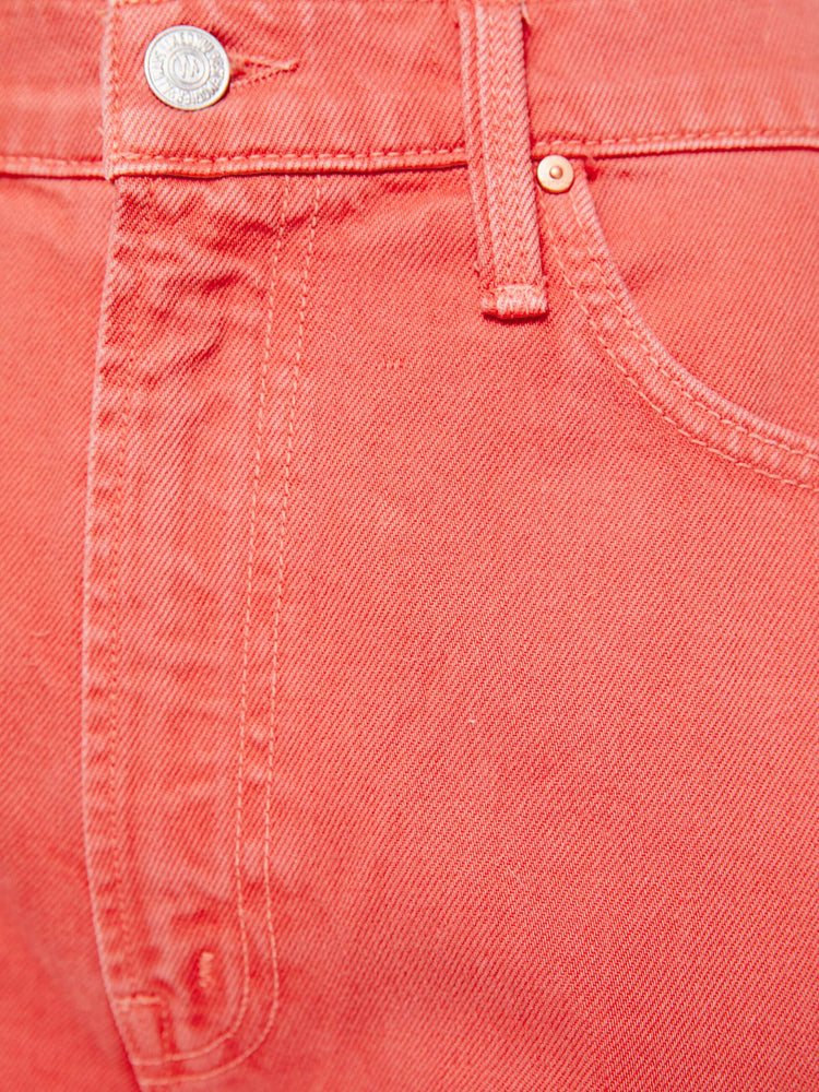 Swatch view of a woman in pants that sit lower on the hips with a zip fly, loose wide leg and a clean ankle-length inseam.