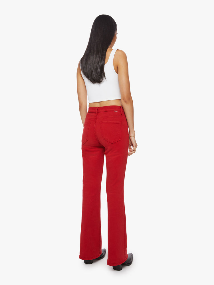 Back view of a bright red hue flare has a high rise, long 31-inch inseam and clean hem.