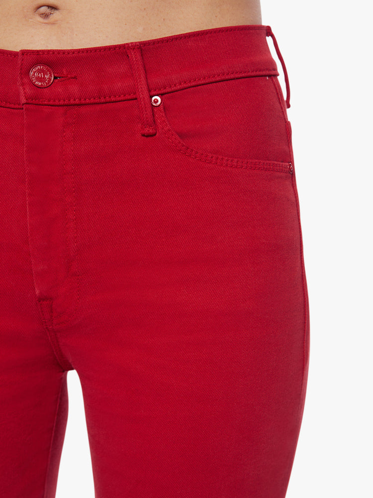 Swatch view of a bright red hue flare has a high rise, long 31-inch inseam and clean hem.