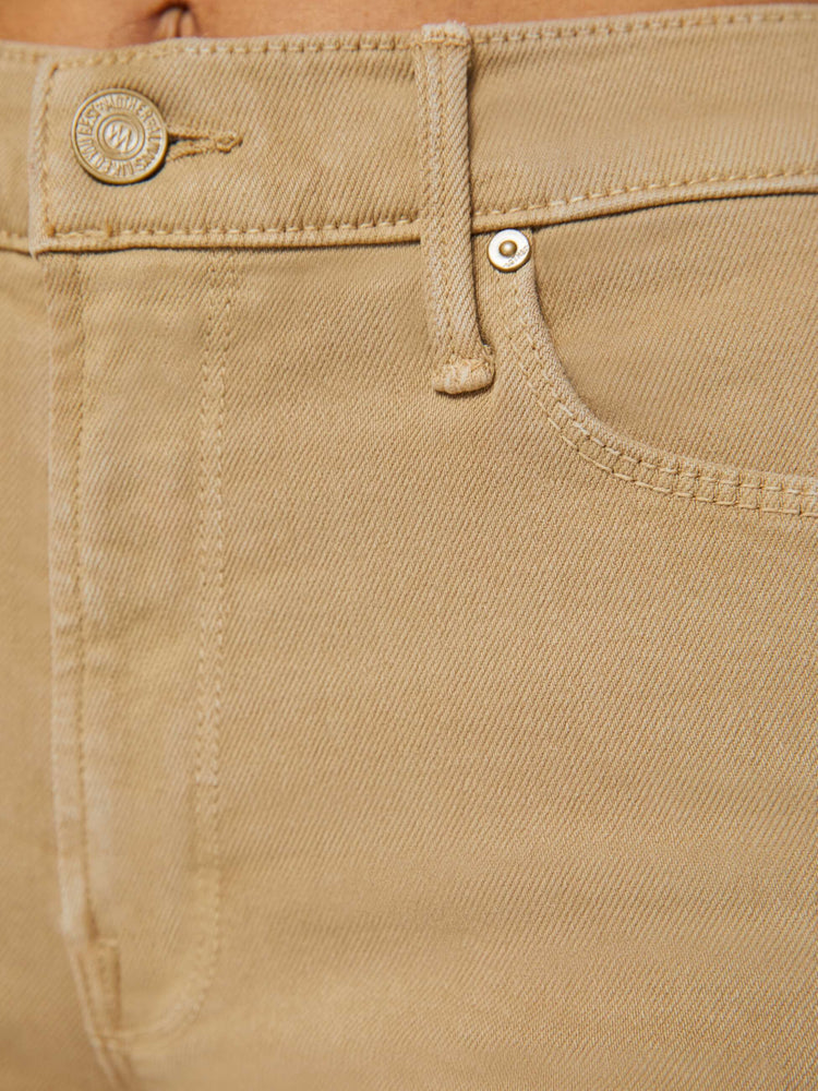 Close up swatch view of a womens brown pant.