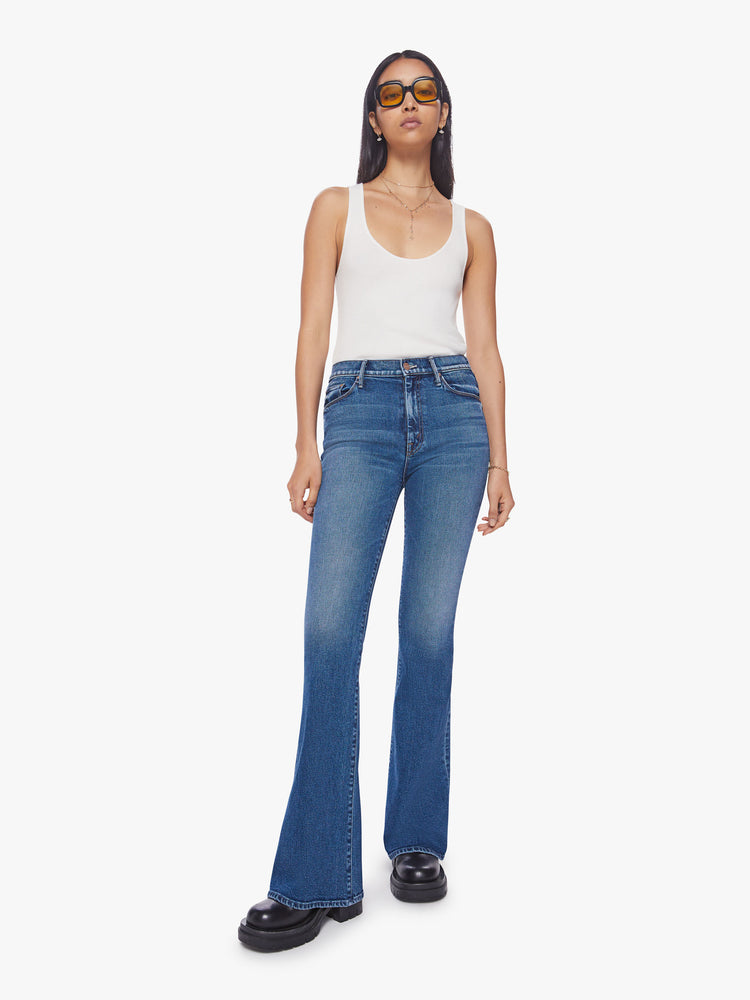Front view of a woman high-rise flare with a long 34.5-inch inseam and a clean hem in a classic blue hue.