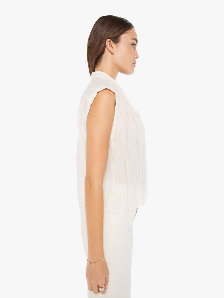 Side view of a womens sleeveless button down shirt featuring a notched collar and two front pockets.