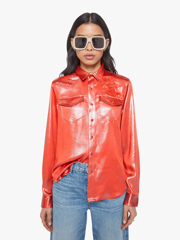 Front view of a woman in red foil denim button-up with front patch pockets and a curved hem.