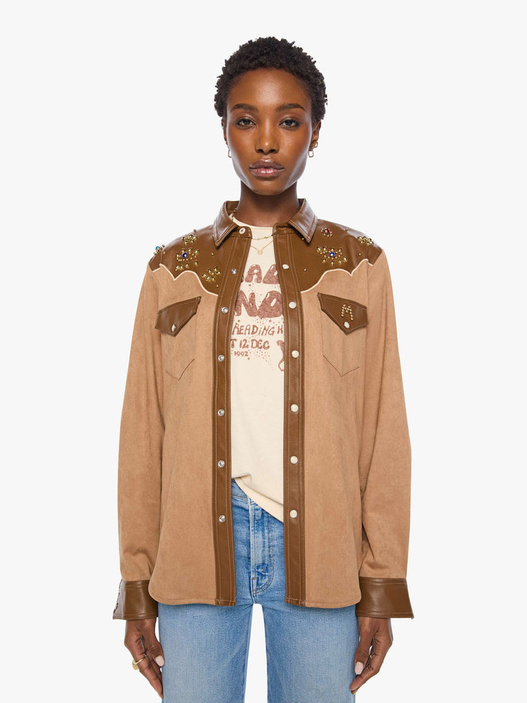 Front view of a woman faux suede and faux leather with studs and gemstone details button-up with a decorative yoke, patch pockets at the chest, snap closures and a curved hem. 