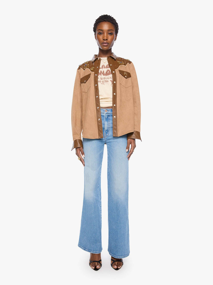 Full body view of a woman faux suede and faux leather with studs and gemstone details button-up with a decorative yoke, patch pockets at the chest, snap closures and a curved hem. 