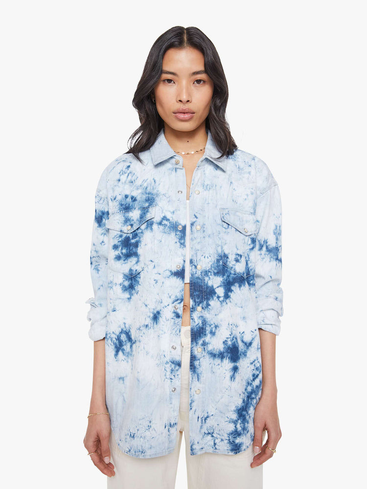 Front view of a bleached tie die oversized button-up with drop shoulders, front patch pockets, a Western-inspired yoke and a curved hem.
