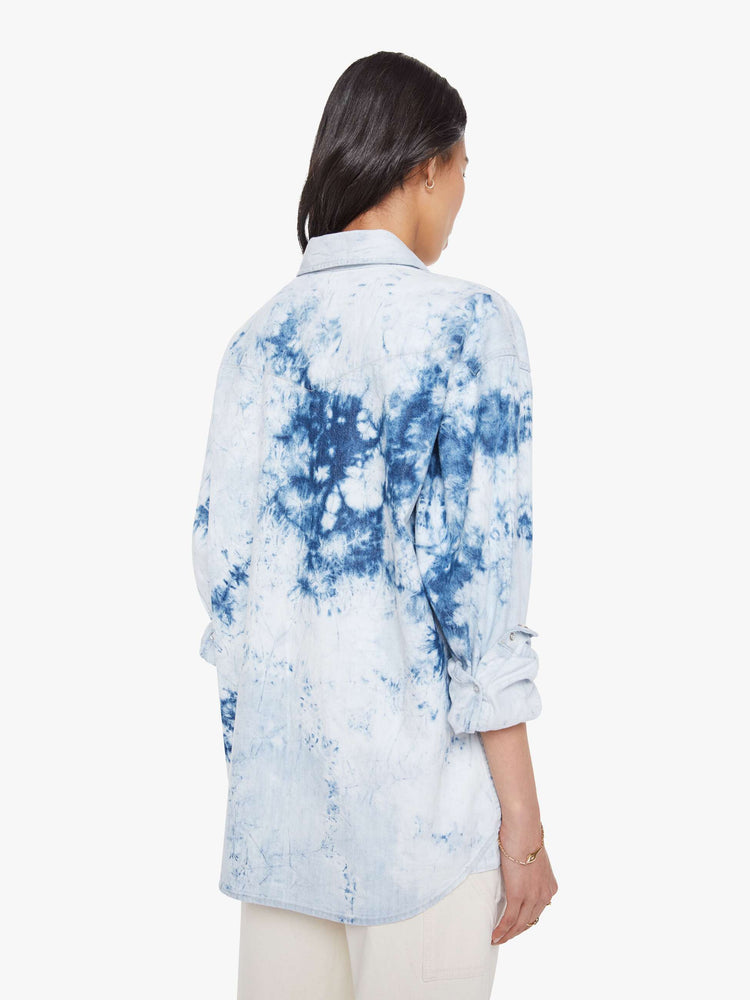 Back view of a bleached tie die oversized button-up with drop shoulders, front patch pockets, a Western-inspired yoke and a curved hem.