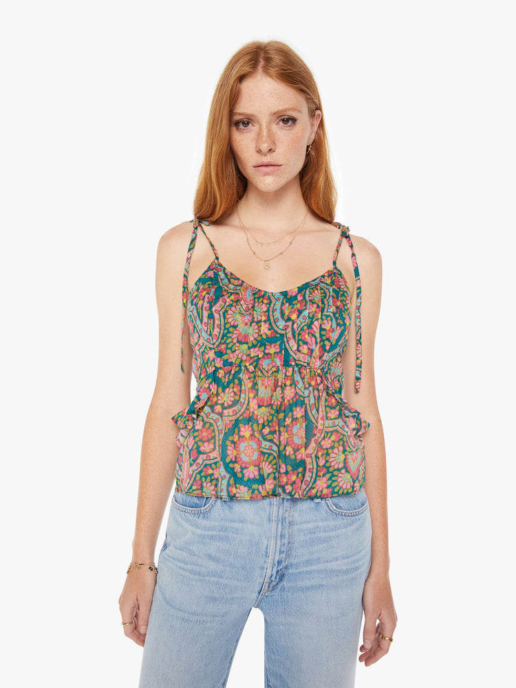 Front view of a womens spaghetti strap top featuring a colorful rug inspired print.
