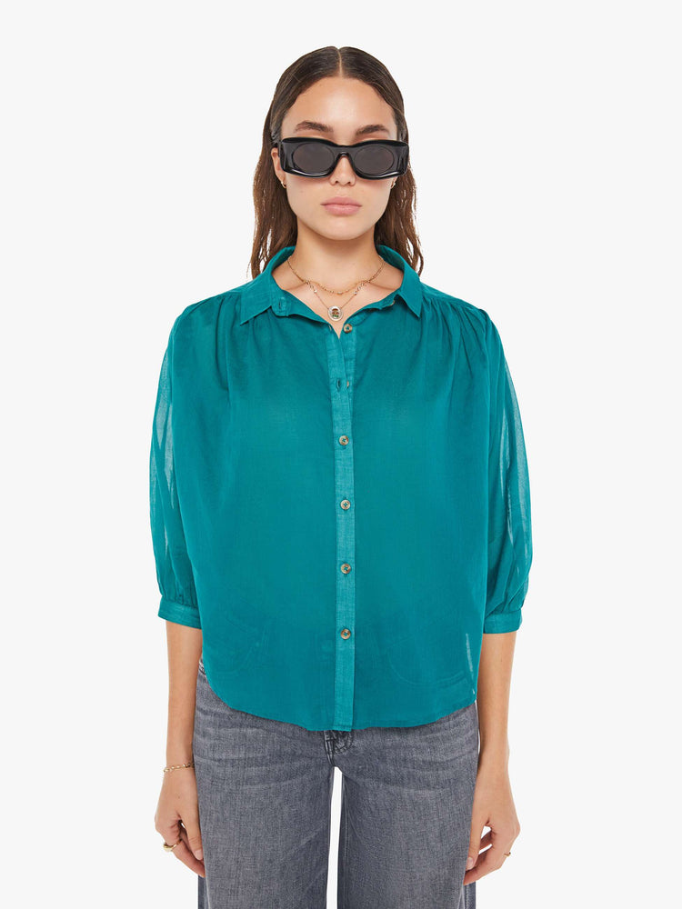 Front view of a womens blouse in a teal green featuring a button down collar and 3/4 length sleeves.