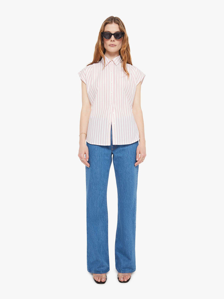 Full body view of a light pink stripe pattern  short-sleeve button-up with an angled bodice and a curved hem. 