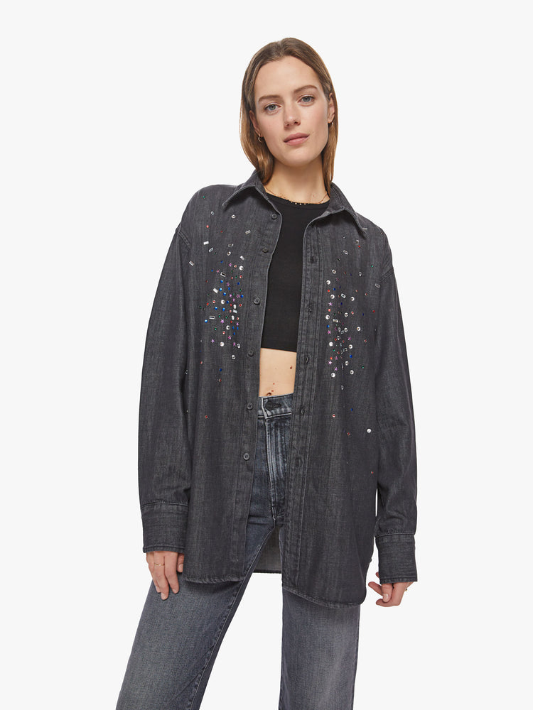 Front view of a woman faded black with jewels on chest oversized button-up with long sleeves and a curved hem.