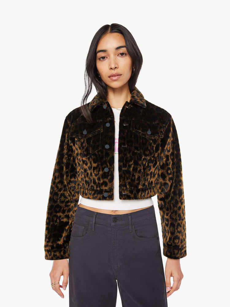 Front view of a woman in leopard print cropped collared jacket with patch pockets, a waist-length hem and buttons down the front.