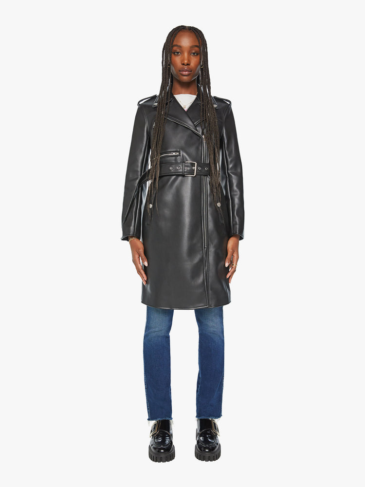 Front view of woman black motorcycle trench coat with a notched collar, belted waist, zip closure and a thigh-grazing hem.