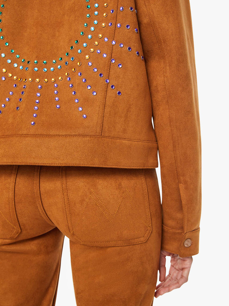 Swatch view of a woman classic collared jacket with drop shoulders, front patch pockets and a boxy fit in a light brown faux suede and multi colored studded gems on the back.