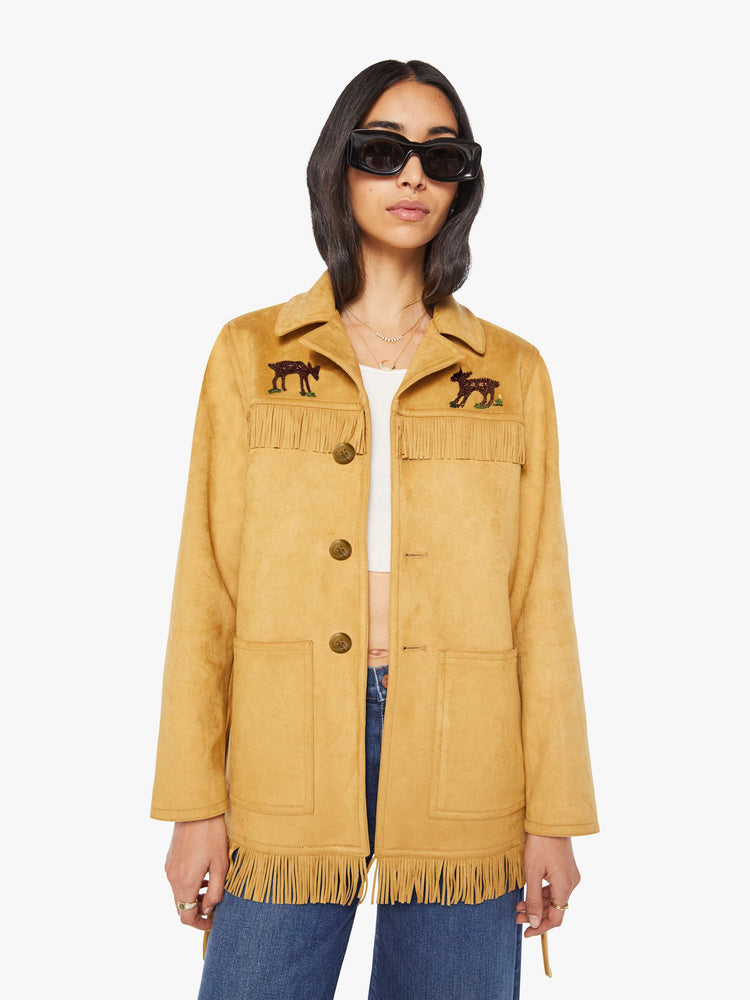 Front view of a woman in faux vintage-inspired jacket with a notched collar, oversized patch pockets, fringe details and an extra-long fit.