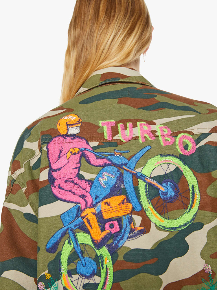 Back close up view of a woman in an army jacket with  oversized patch pockets, slightly dropped shoulders, buttons down the front and an oversized fit. 