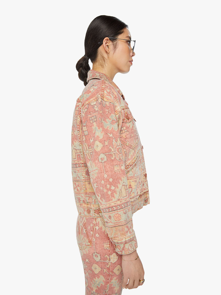 Side view of a woman button-up jacket with drop shoulders, front patch pockets and a cropped, boxy fit in a Moroccan rug print.