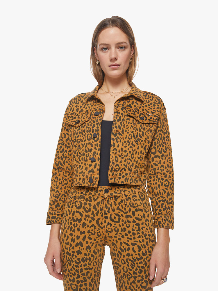 Front view of a woman bold leopard print cropped jacket with drop shoulders, front patch pockets and a loose fit.