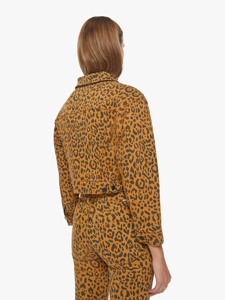 Back view of a woman bold leopard print cropped jacket with drop shoulders, front patch pockets and a loose fit.
