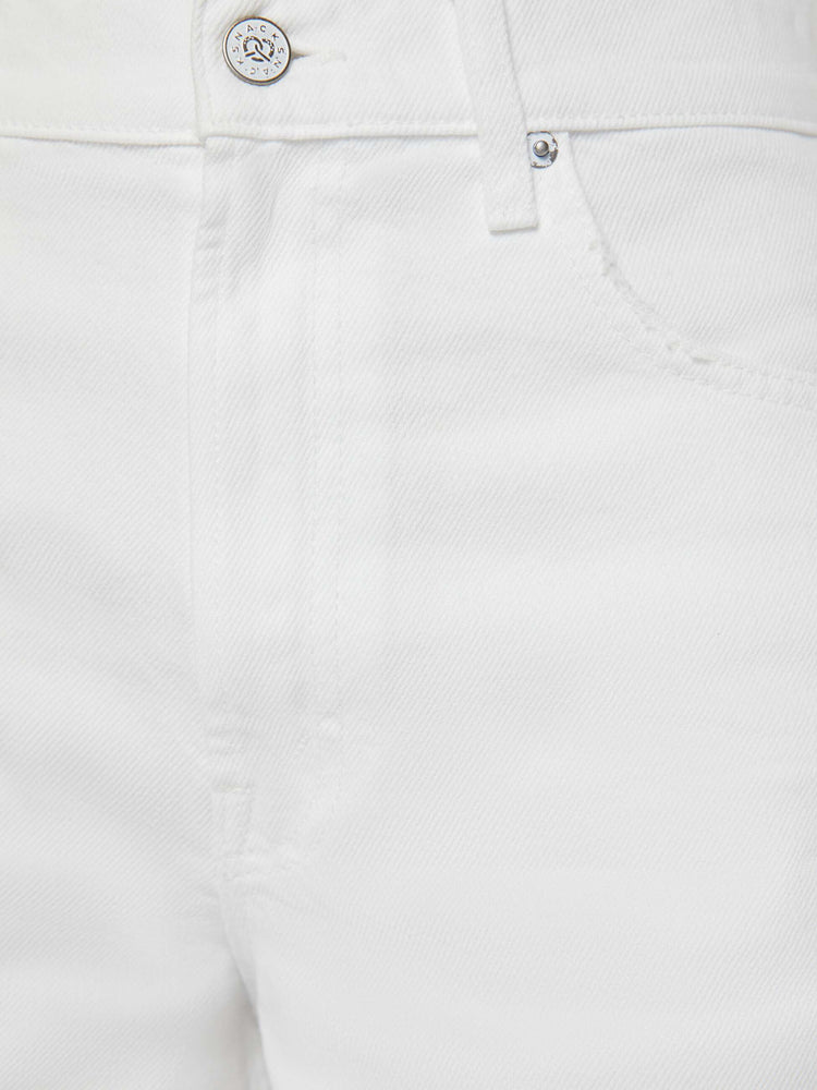 Swatch view of a woman in off-white shorts that have a super-high rise, loose leg with a frayed hem and a pretzel-detailed button.