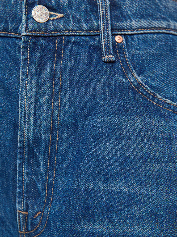 Swatch view of woman in med blue high-waisted shorts have a low-slung fit and feature a wide leg, zip fly, calf-length inseam and a clean hem.