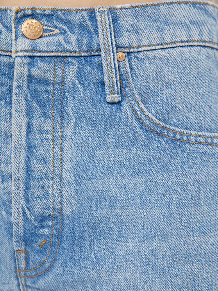 Swatch view of a woman in a light blue shorts have a relaxed fit, button fly and a 4-inch inseam with a cuffed hem.