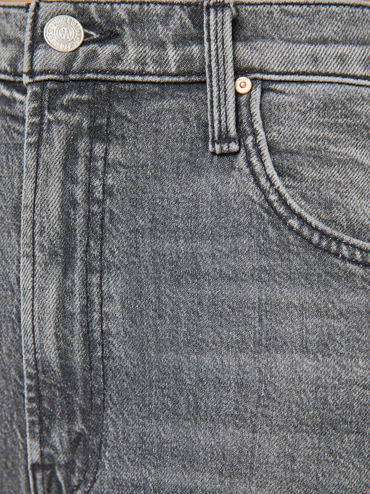 Swatch view of a woman in a light grey super high-waisted shorts with a wide leg, zip fly, calf-length inseam and a frayed hem.