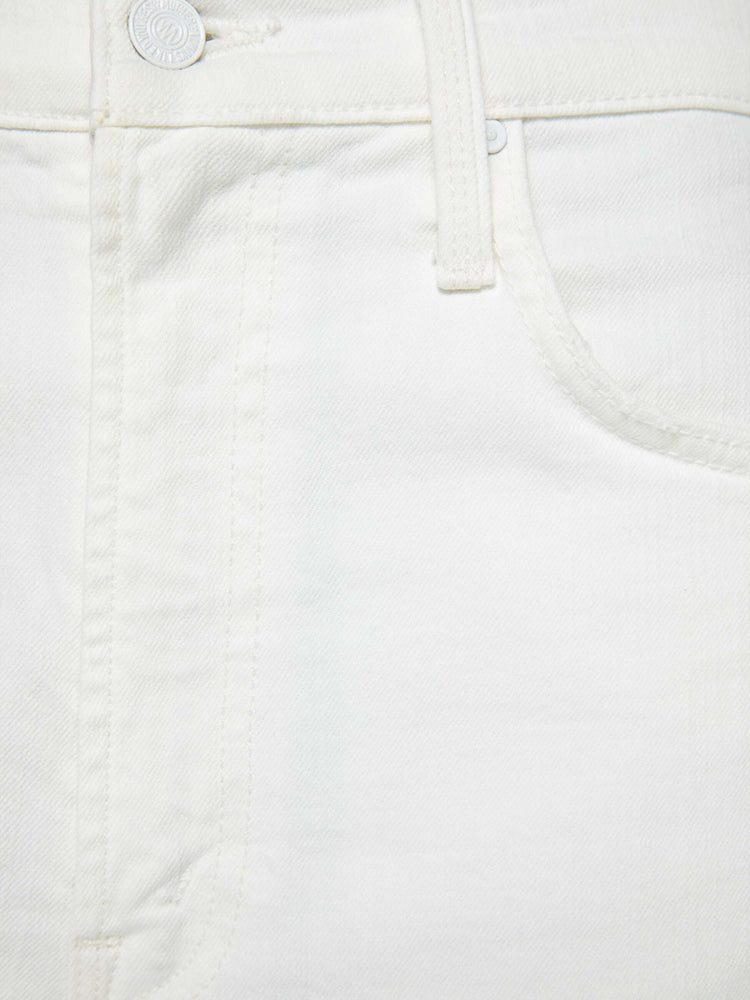 Swatch view of a woman in a white super high-waisted shorts with a wide leg, zip fly, calf-length inseam and a frayed hem.