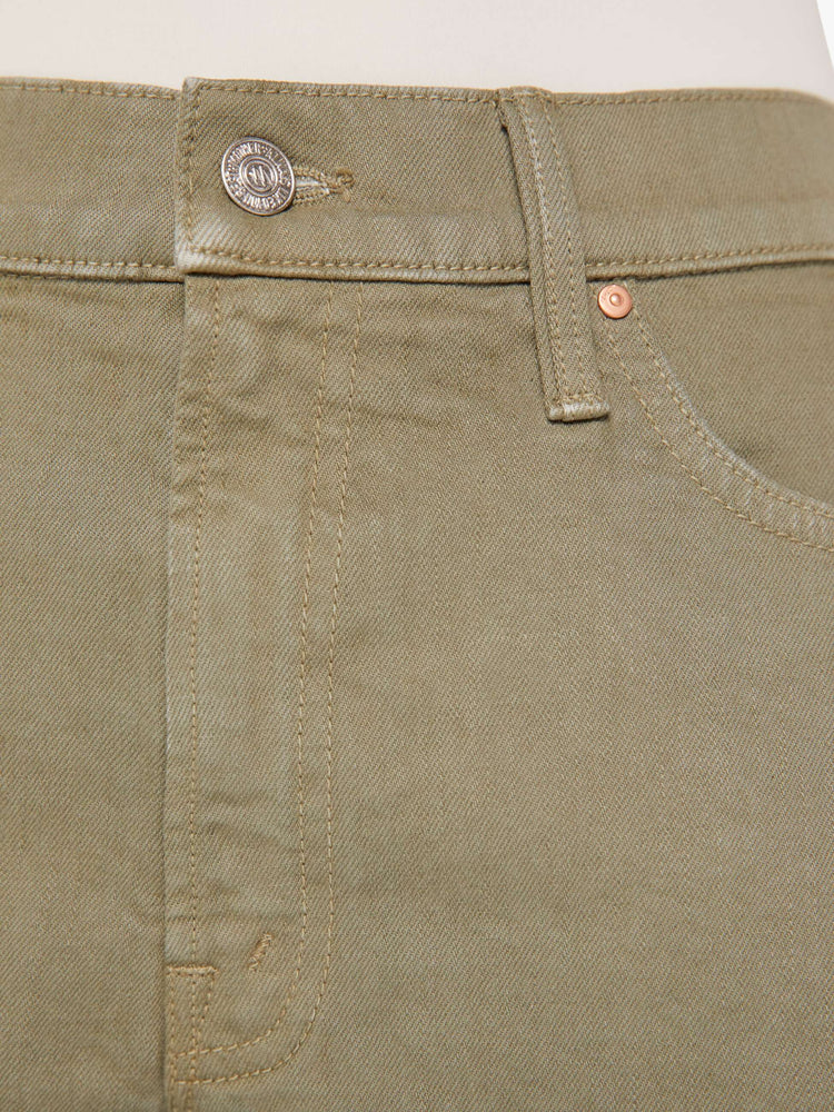 Close up swatch view of a greenish brown jean.