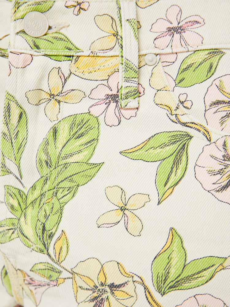 Swatch view of a woman in blossom print  denim shorts are designed to sit lower on the hips with a loose leg, zip fly and 3.5-inch inseam with a frayed hem. 