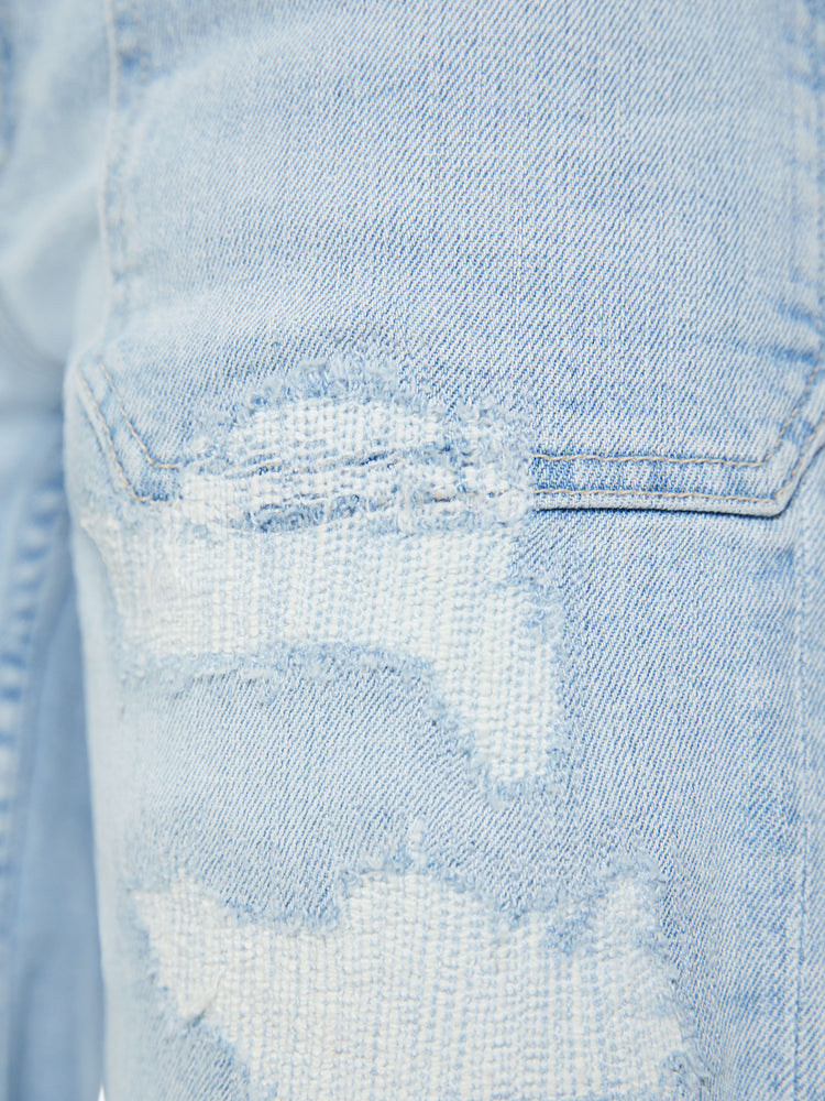 Swatch view of a woman light blue bermuda shorts with a high rise, oversized patch pockets, a 9-inch inseam and a raw hem.