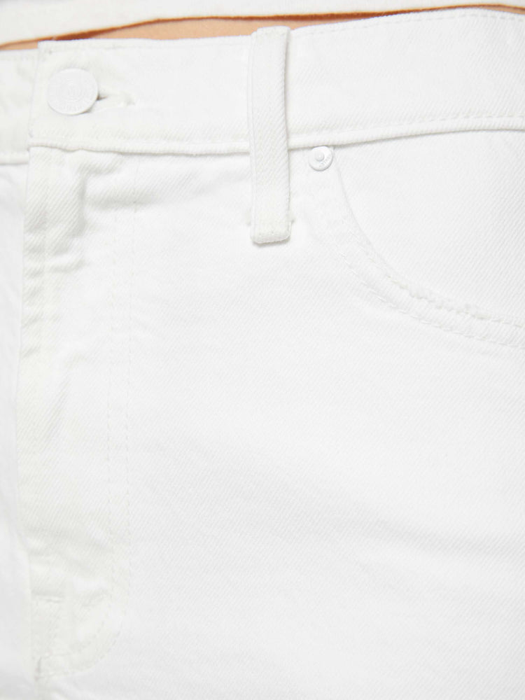 Swatch view of a woman in a white  denim shorts are designed to sit lower on the hips with a loose leg, zip fly and 3.5-inch inseam with a clean hem. 