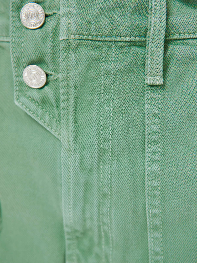Swatch view of a woman in a faded sage green super high-waisted shorts with oversized patch pockets, a tabbed waistband with exposed buttons and a zip fly, a 2.75-inch inseam and a clean hem. 