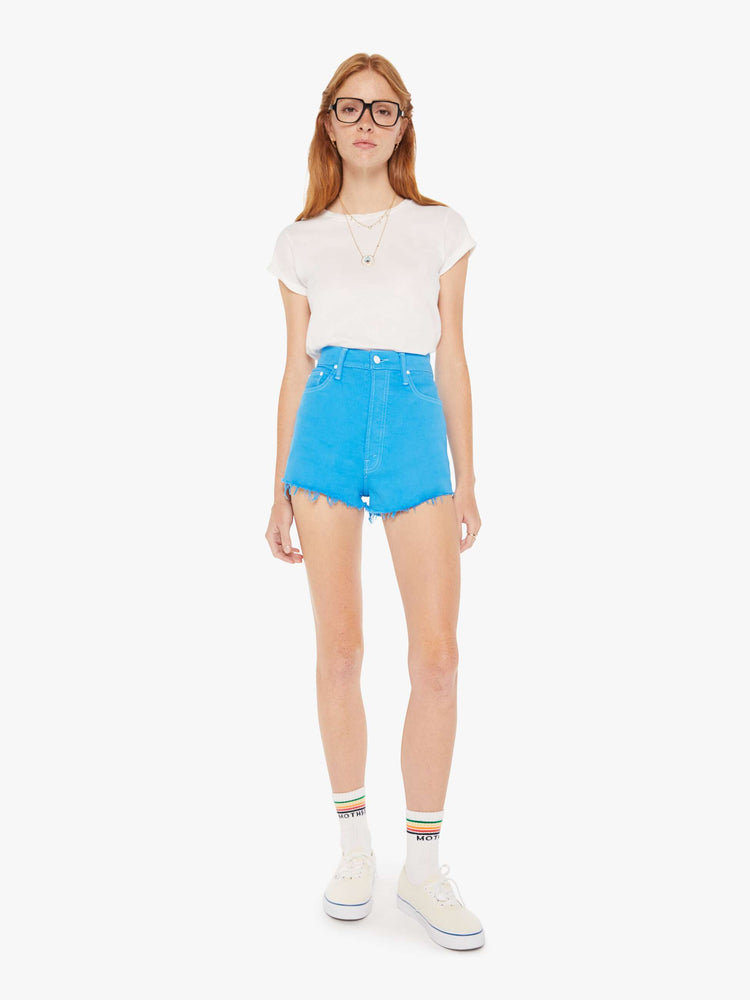 Front view of a woman in vintage-inspired shorts designed with a super-high rise, narrow fit and a short frayed hem.