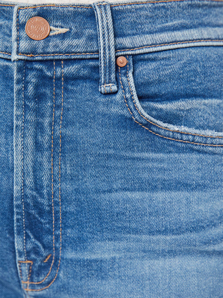 Swatch view of a woman in a high-waisted denim shorts with a straight leg, zip fly, 9-inch inseam and a frayed hem.
