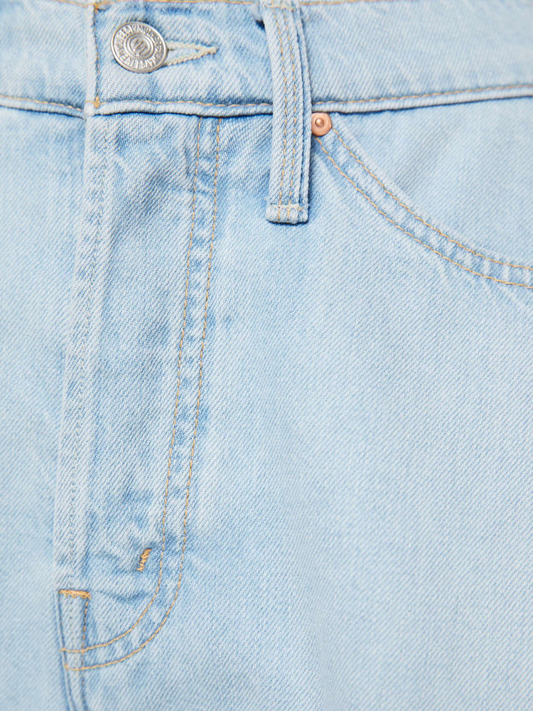 Close up view of a woman in a super high-waisted denim shorts with a button fly, 3.25-inch inseam and a wide leg opening that flares out.