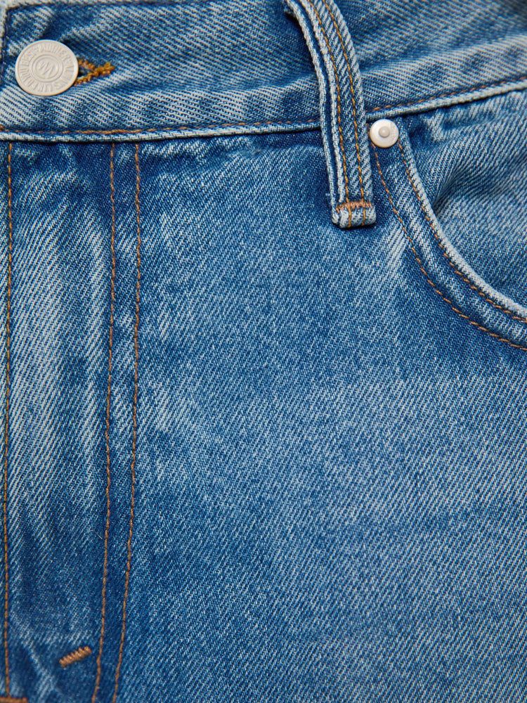 Swatch view of a man in light blue loose-fitting jean with a mid rise, zip fly, 31-inch inseam and a clean hem.